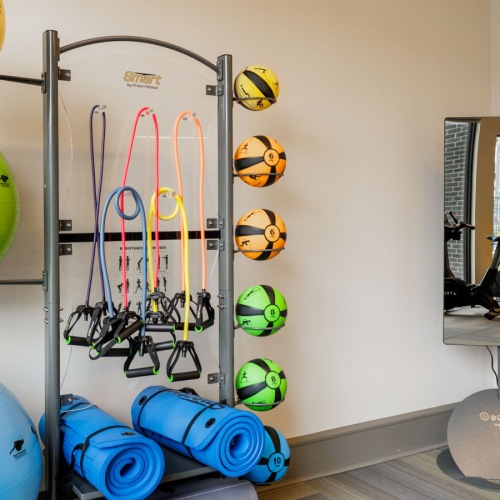 fitness center at Avelyn San Marcos with large mirrors