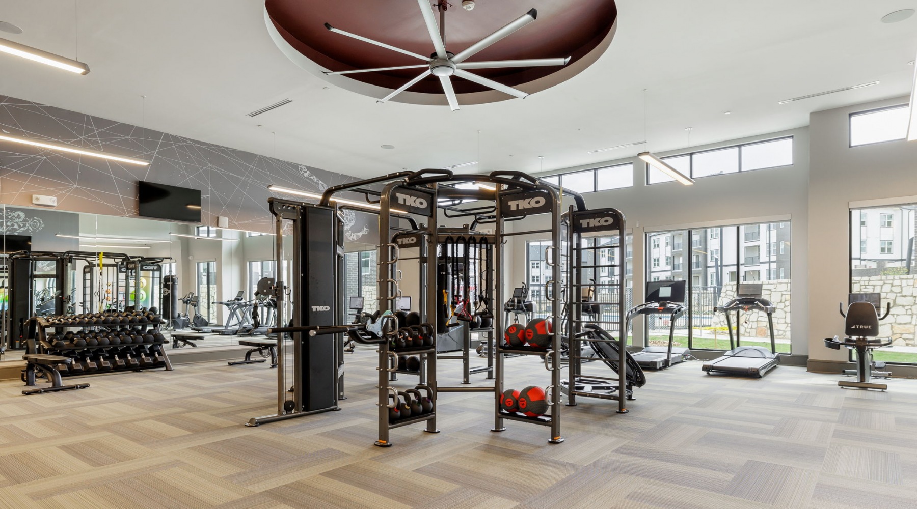 Well-equipped fitness center with treadmills at Avelyn San Marcos apartments in San Marcos.